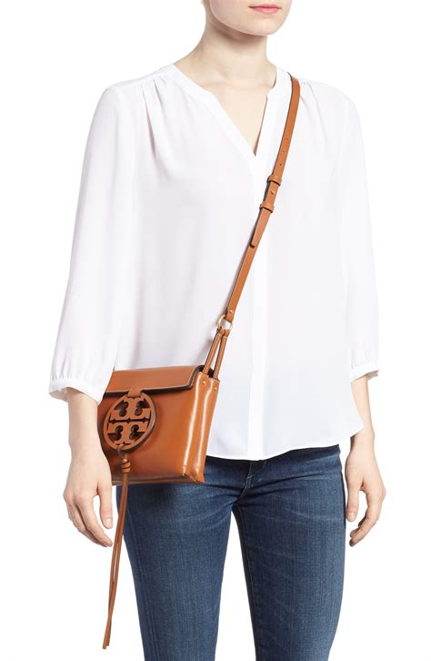 Natural-grain leather with our signature Double T. . Tory burch miller crossbody